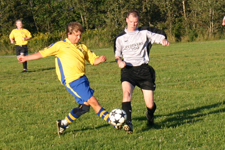 A battle for a loose ball during recent upper division action.