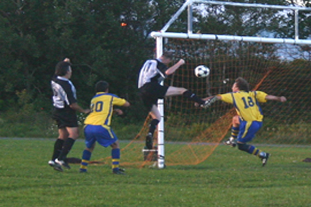 Peddlers Too Stallions Ted Power puts a header into the back of the net during a recent match versus Mexicalla Rosa's.