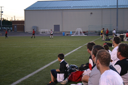 The Alumitech bench watches a cross in front of the Foresthill net.