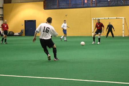 Albion's Shawn Langille attempts to pass by a Forest Hill defender.