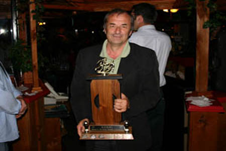 Ray Riddell accepts the Masters Division Championship trophy.