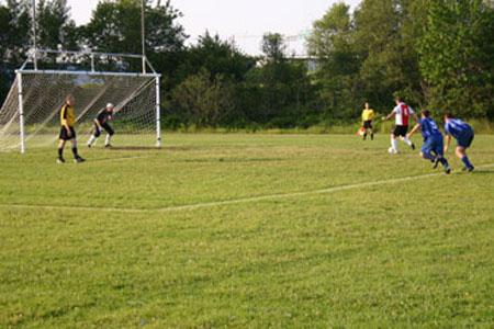 Sporting Rangers Jerry Myles shoots a penalty shot against Bridgewater.  Myles managed to get the ball past the Bridgewater keeper.